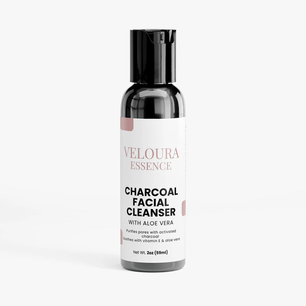 Bottle of Veloura Essence Charcoal Facial Cleanser with Aloe Vera on a white background