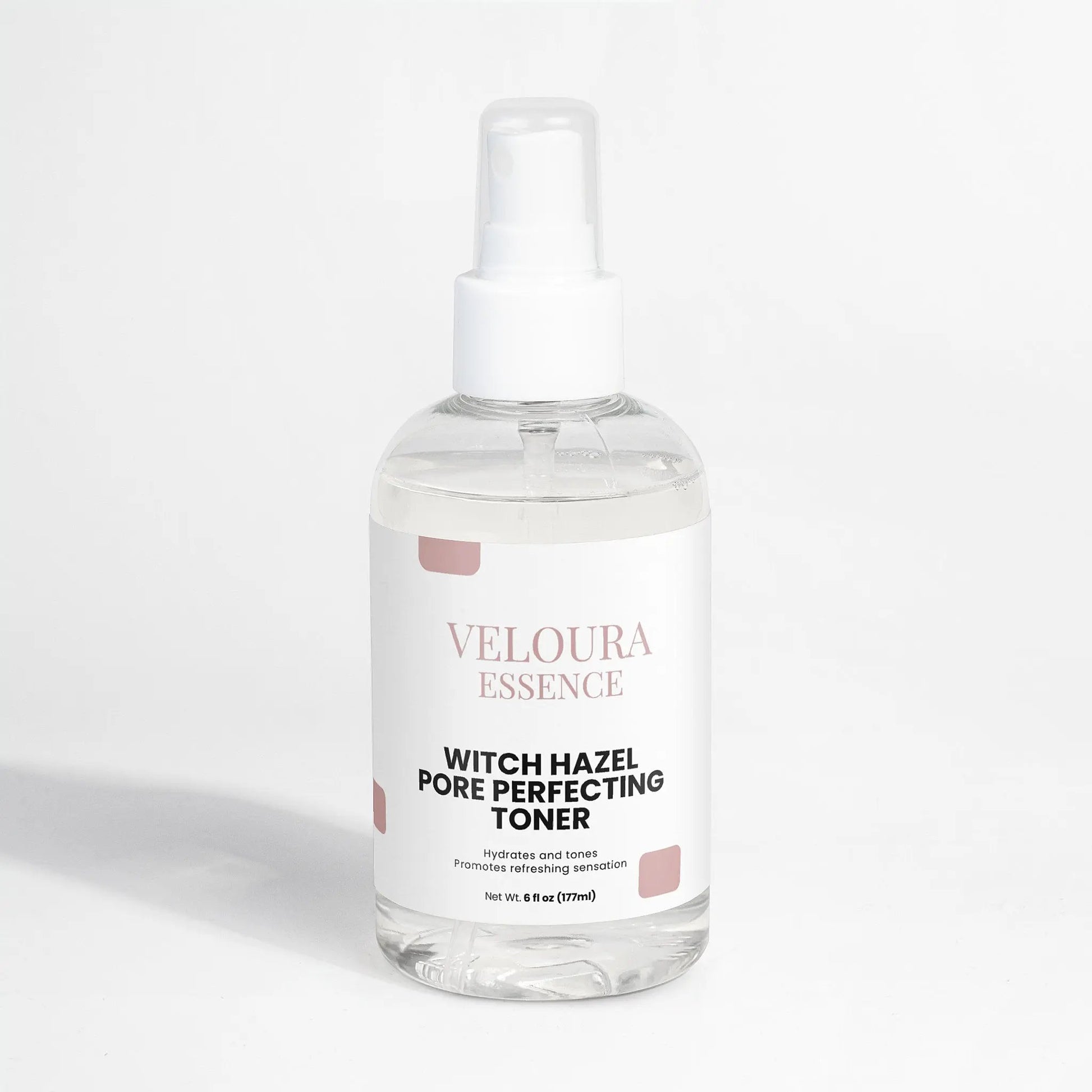 Bottle of Veloura Essence Witch Hazel Pore Perfecting Toner on a white background