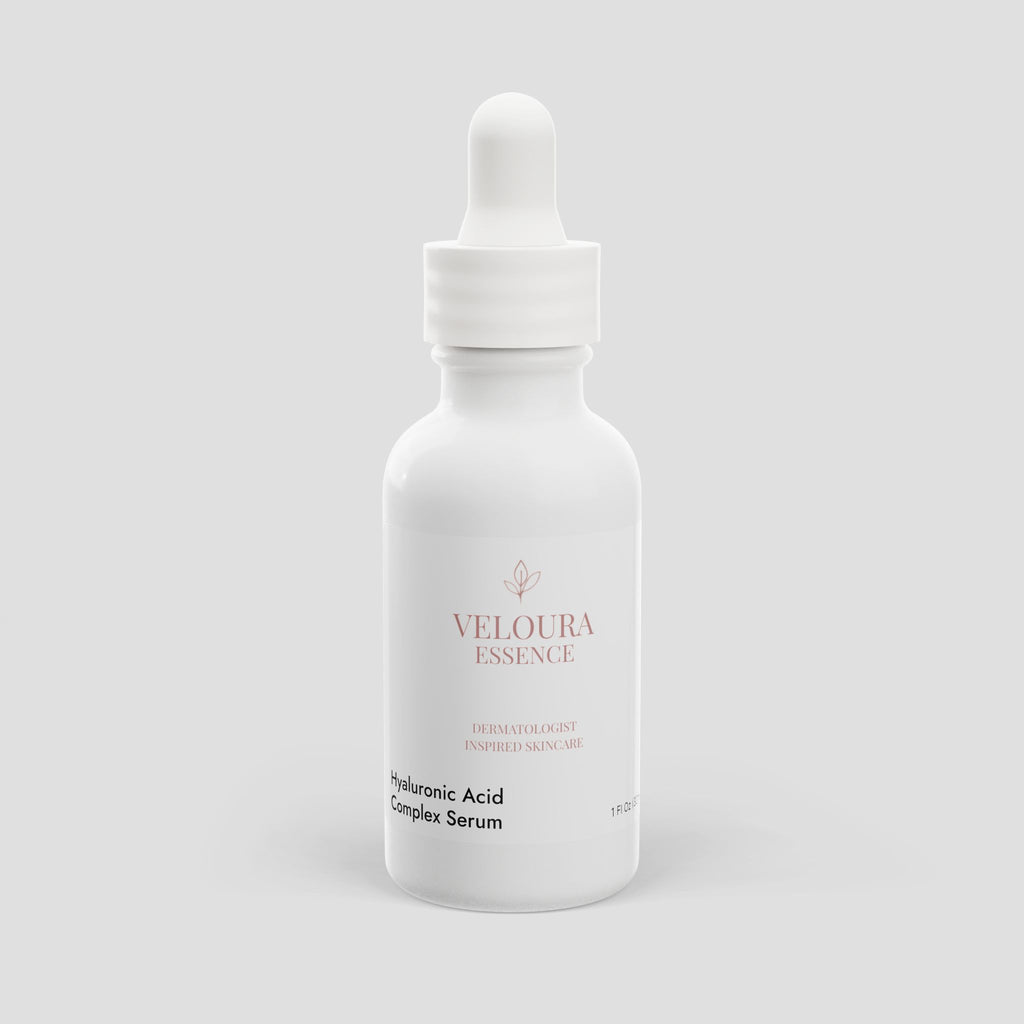 Veloura Essence Hyaluronic Acid Complex Serum bottle on a light gray background