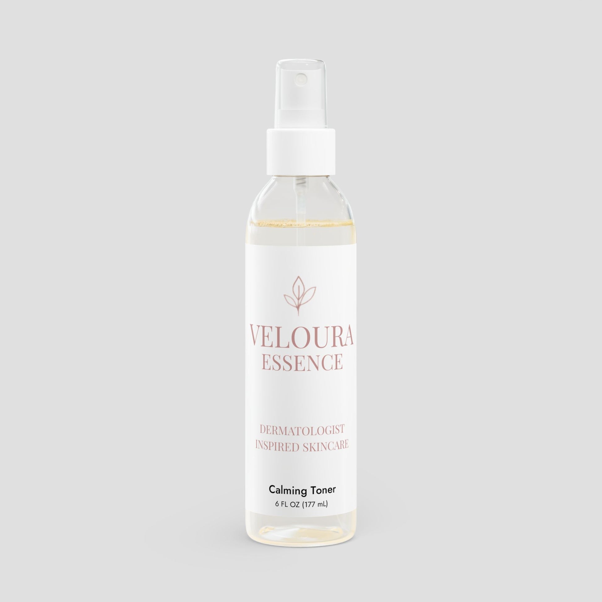 Veloura Essence calming toner bottle on a light gray background